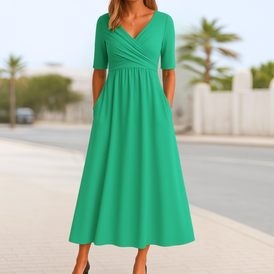 Women's navy blue wrap-style midi dress with cross front and short sleeves