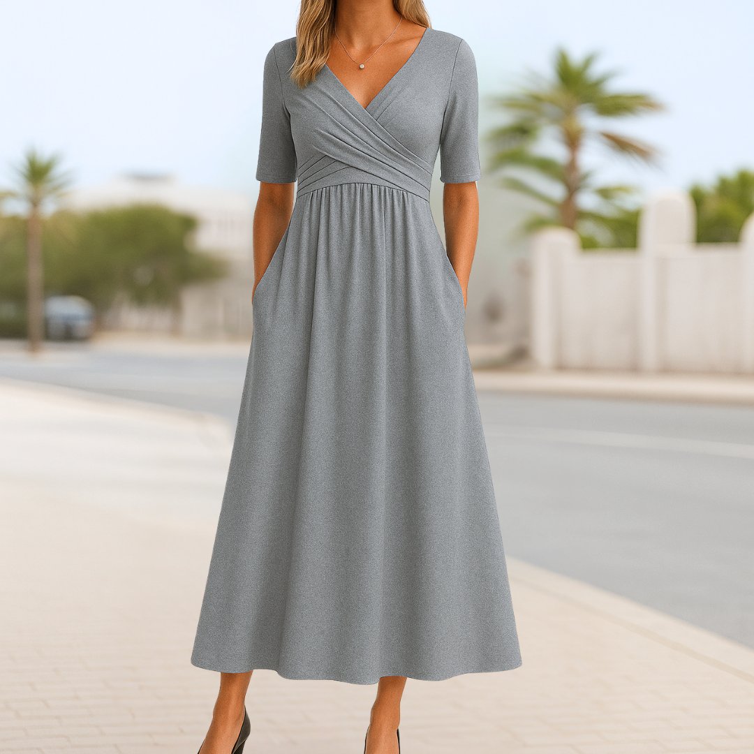 Women's navy blue wrap-style midi dress with cross front and short sleeves