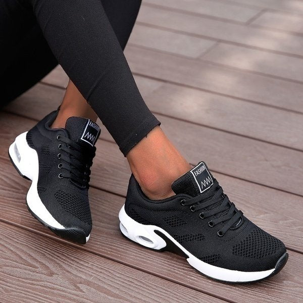 Women's black mesh walking trainers with cushioned sole and lace-up fit