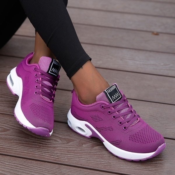 Women's black mesh walking trainers with cushioned sole and lace-up fit