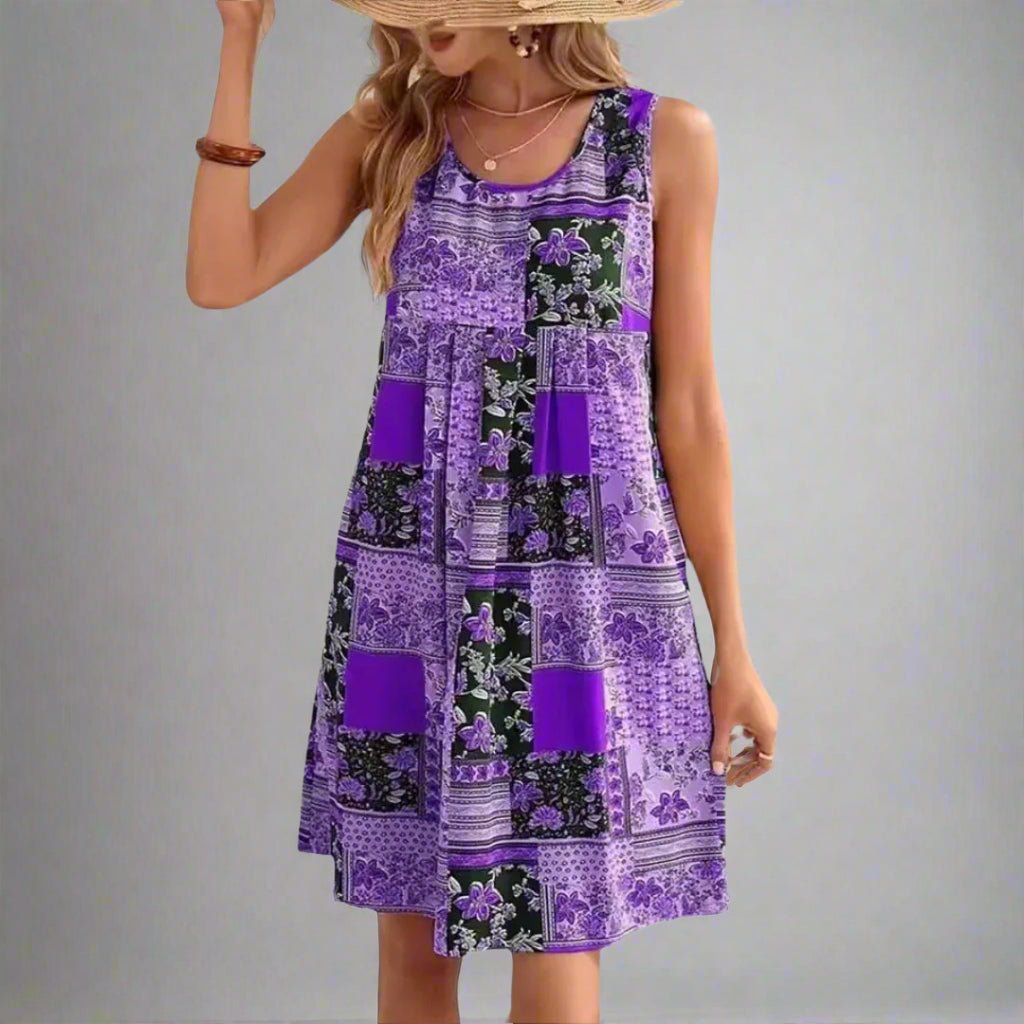 Women's blue sleeveless mini shift dress with a patchwork print