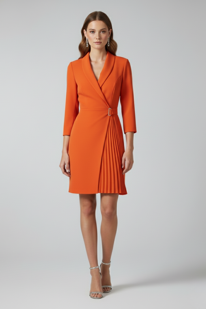 Women's pink notched collar blazer dress with a defined waist and straight hem