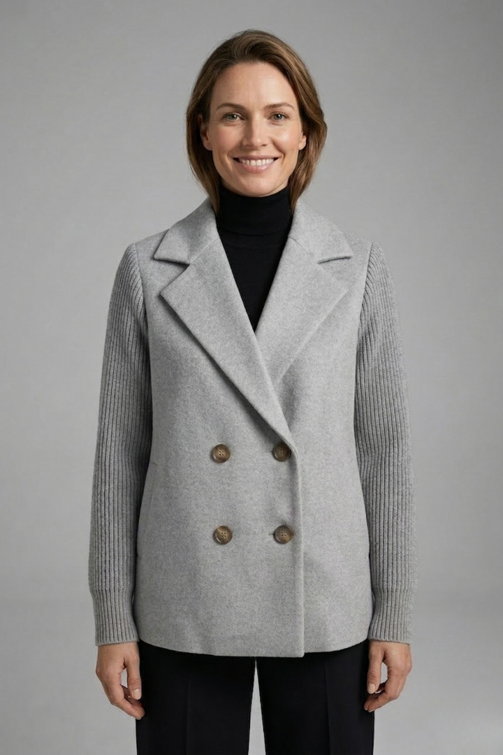 Women's black double-breasted blazer with a lapel collar and ribbed sleeves
