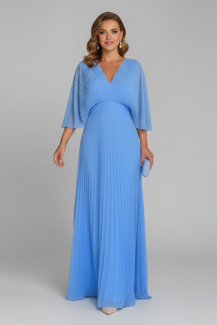 Women's yellow long sleeve maxi dress with pleated skirt and wrap front