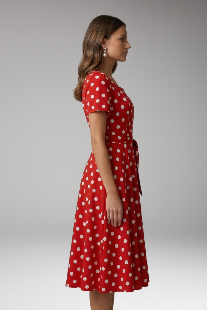Women's red polka dot tea dress with V-neck and flared skirt