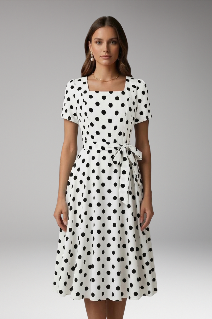 Women's white polka dot tea dress with V-neck and flared skirt