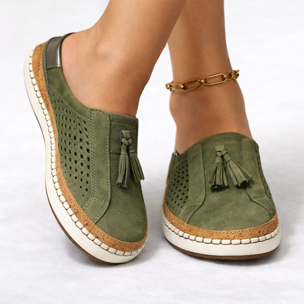 Women's green slip-on tassel loafers with perforated panels