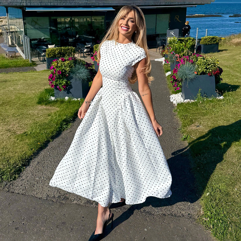 Women's black polka dot maxi dress with cap sleeves and high neck