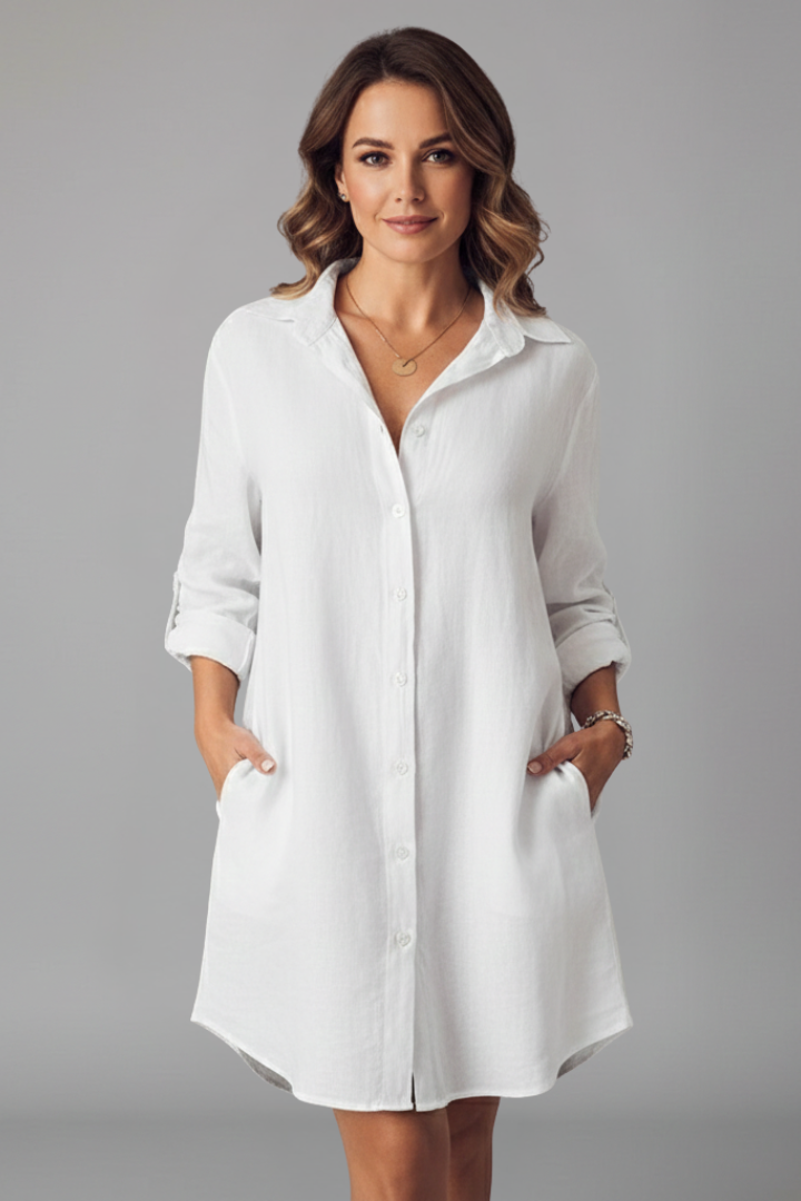 Women's blue button-through shirt dress with collar and side pockets