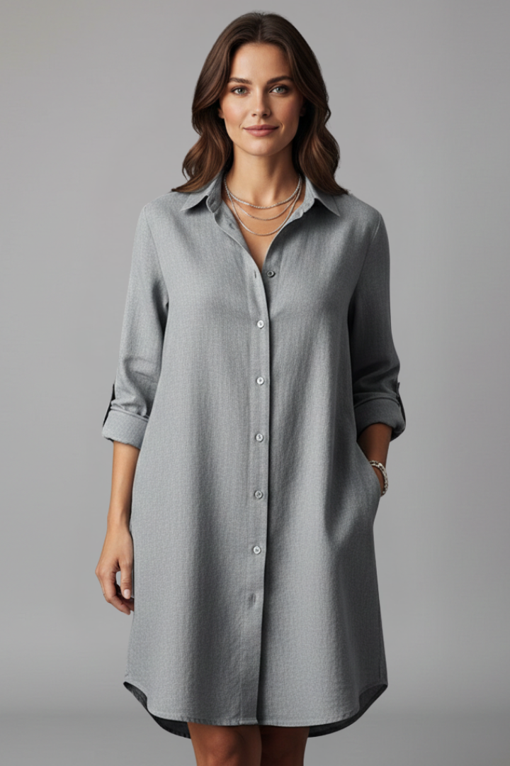Women's blue button-through shirt dress with collar and side pockets