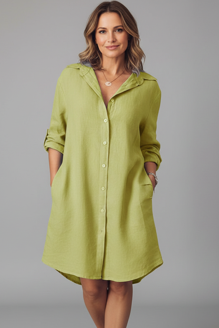 Women's white button-through shirt dress with collar and side pockets