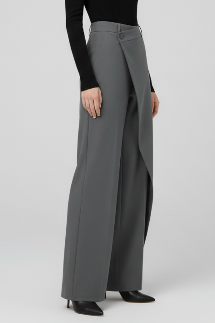 Grey straight-leg trousers featuring a tailored asymmetric front panel design