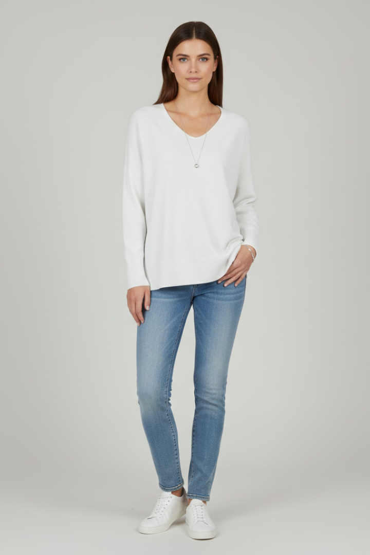 Women's white V-neck jumper with dropped shoulders and a straight hem