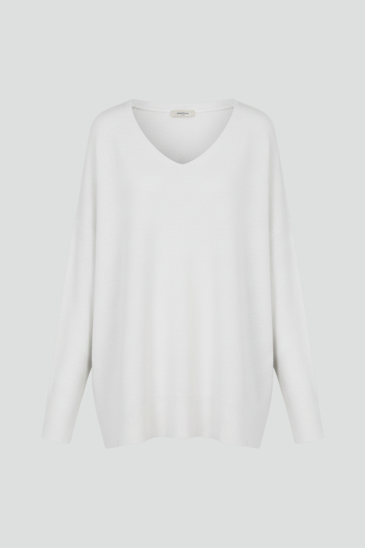 Women's white V-neck jumper with dropped shoulders and a straight hem