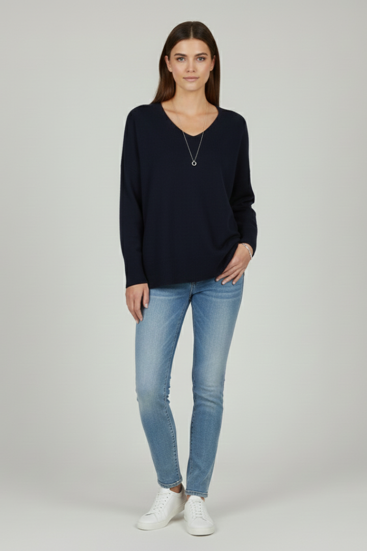 Women's white V-neck jumper with dropped shoulders and a straight hem