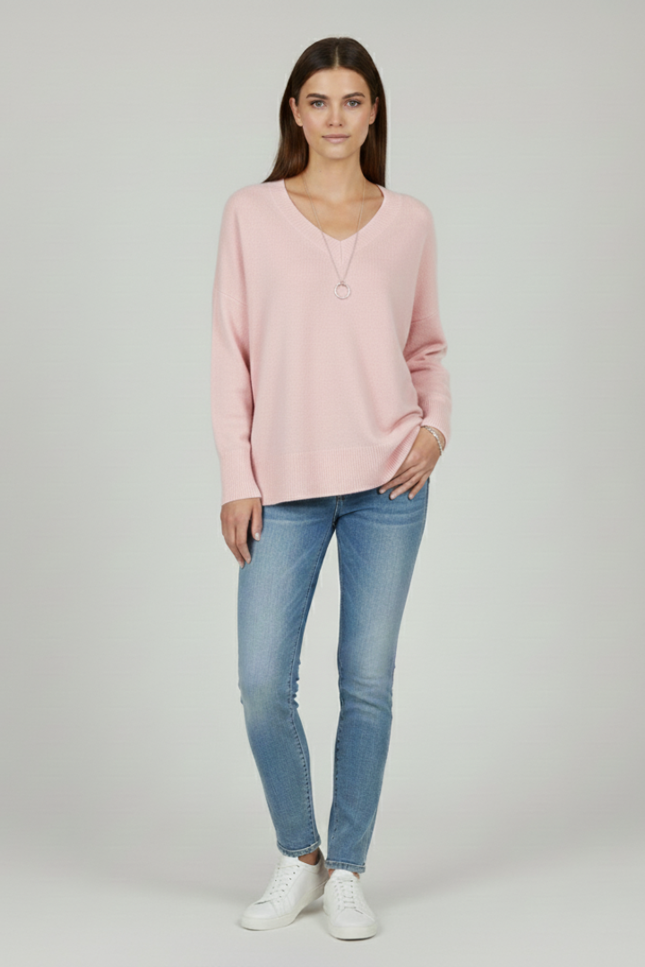 Women's white V-neck jumper with dropped shoulders and a straight hem