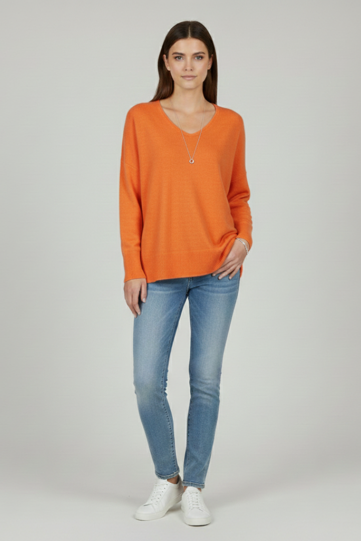 Women's white V-neck jumper with dropped shoulders and a straight hem